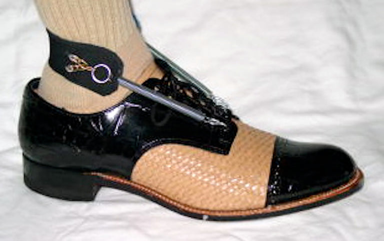 Freedom Walk AFO Free Flex original spring model drop foot brace on black and beige dress shoe