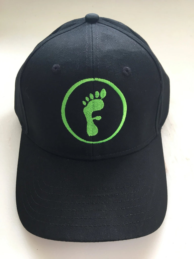 Freedom Walk AFO Free Flex Logo on black baseball style hat and green logo of a foot in the shape of the letter F