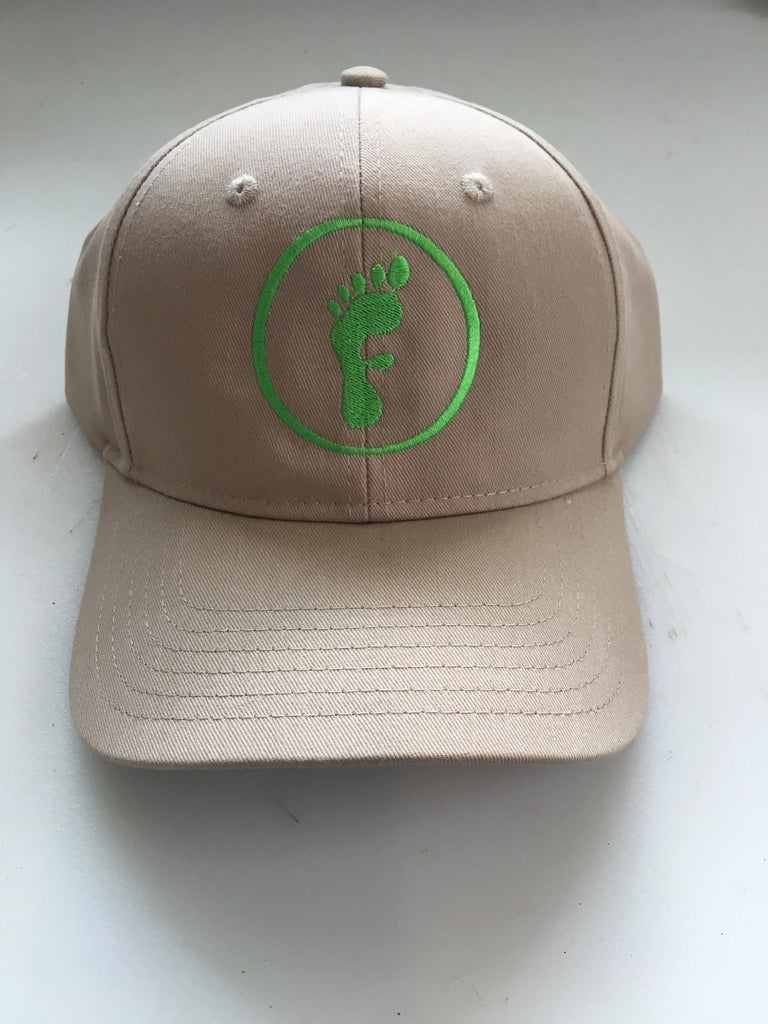 Freedom Walk AFO Free Flex Logo on beige baseball style hat and green logo of a foot in the shape of the letter F