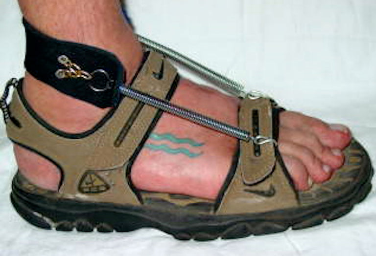 Freedom Walk AFO Free Flex original spring model drop foot brace on beige sandal